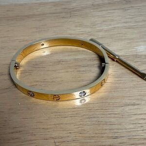 Source Unknown Gold-tone Screw Motif Bracelet with Clear Stones